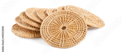 Round wicker rattan place mat and coaster on white background