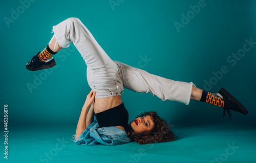 Artistic modern dancer on dark wall