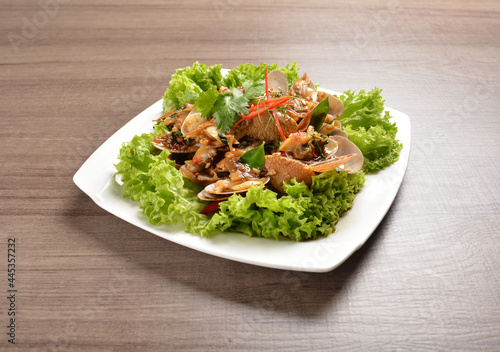 stir fried flower clam shell seafood with sambal spicy chilli sauce on wood background asian halal menu