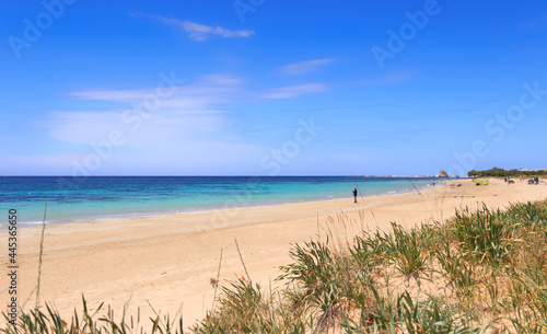 Marina di Salve Beach, almost sandy and embellished with low cliffs, easy to reach in the area of the municipalities of Salve and Ugento in Apulia, Italy. In background Torre Pali watchtower.