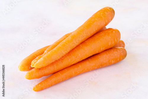 Carrots on a white wooden background