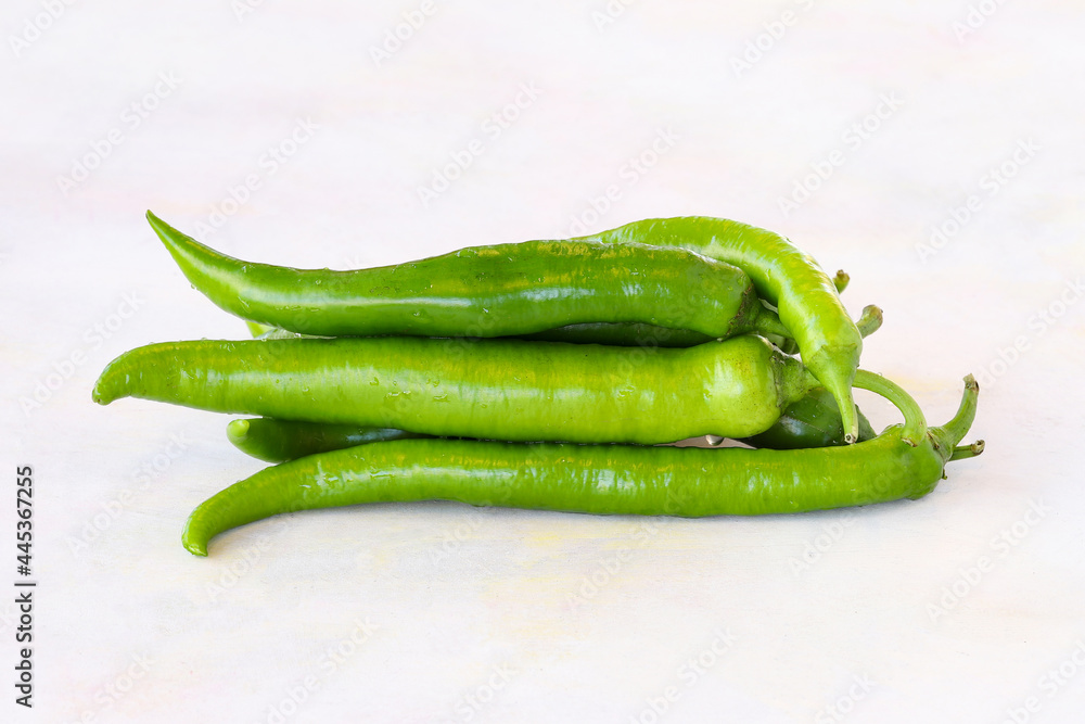 Green pepper on a white wooden background Green pepper on a white wooden background
