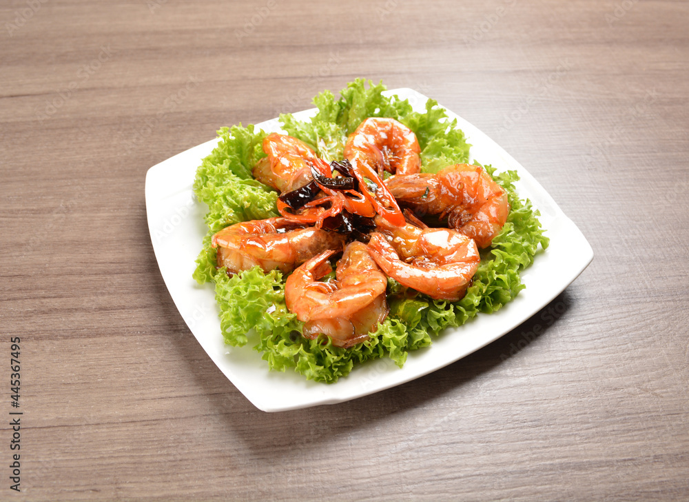 stir fried bbq tiger prawn seafood with Thai spicy chilli sweet sauce on wood background asian halal set lunch menu stir fried bbq tiger prawn seafood with Thai spicy chilli sweet sauce on wood background asian halal set lunch menu