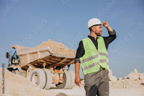 Male worker with bulldozer in sand quarry