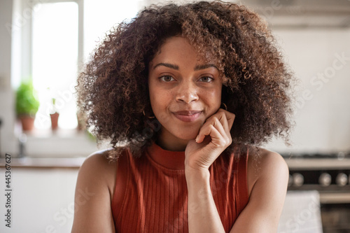 Portrait of happy African American female at home in kitchen