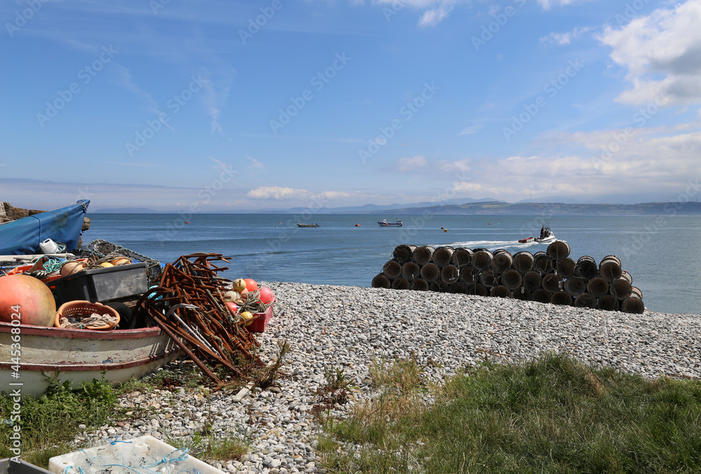 Fishing equipment stored on the beach at Moelfre, Anglesey, Wales, UK.