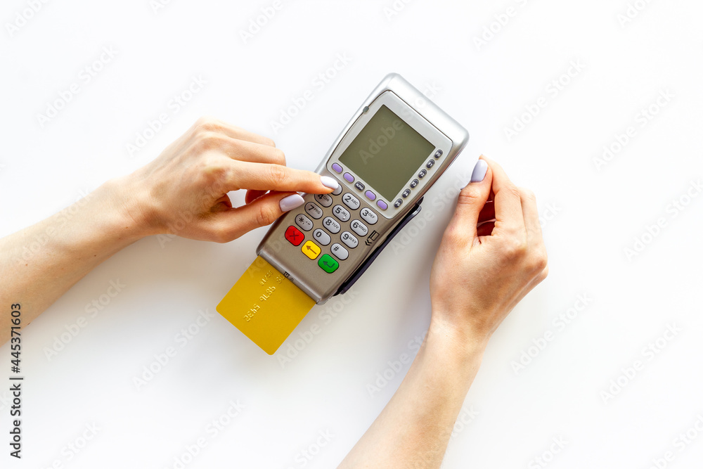 Hand swiping credit card by pos terminal. Payment transactions concept Hand swiping credit card by pos terminal. Payment transactions concept