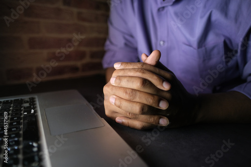 hacker hand stealing data from laptop top down 