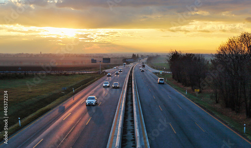 Highway transportation with cars at sunset traffic