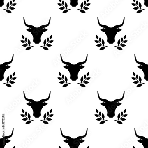 Seamless ornament with bull head and laurel. Ox, cow pattern.