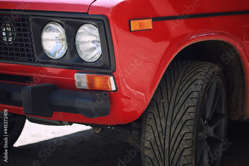 headlight of a red vintage car