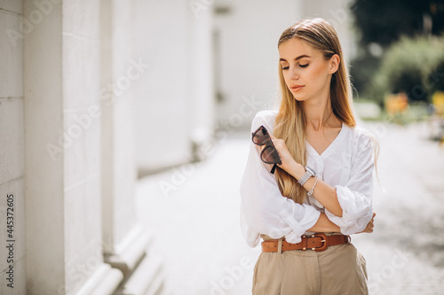 Young woman dressed in summer outfit out in the city photo