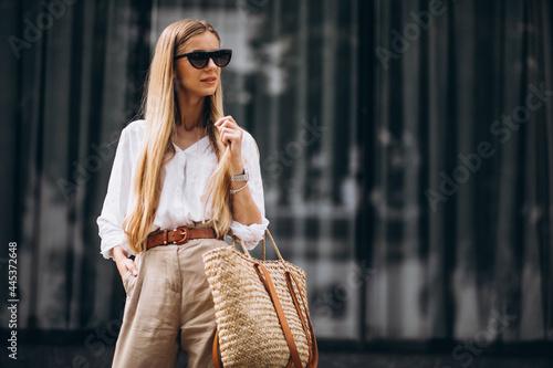 Young woman dressed in summer outfit out in the city photo