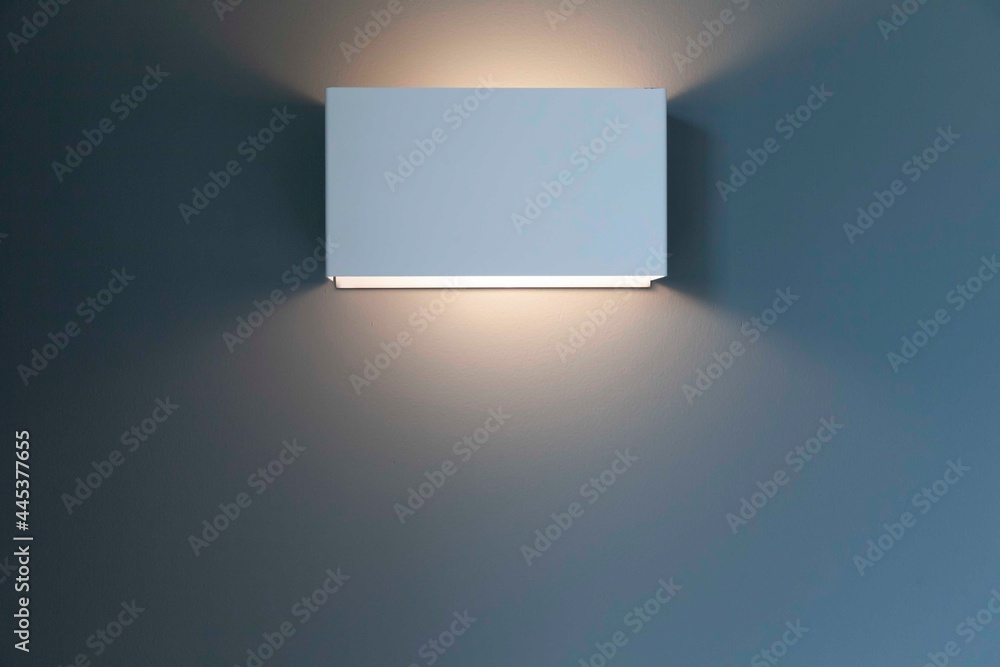 White stainless steel bedside lamp in modern bedroom White stainless steel bedside lamp in modern bedroom