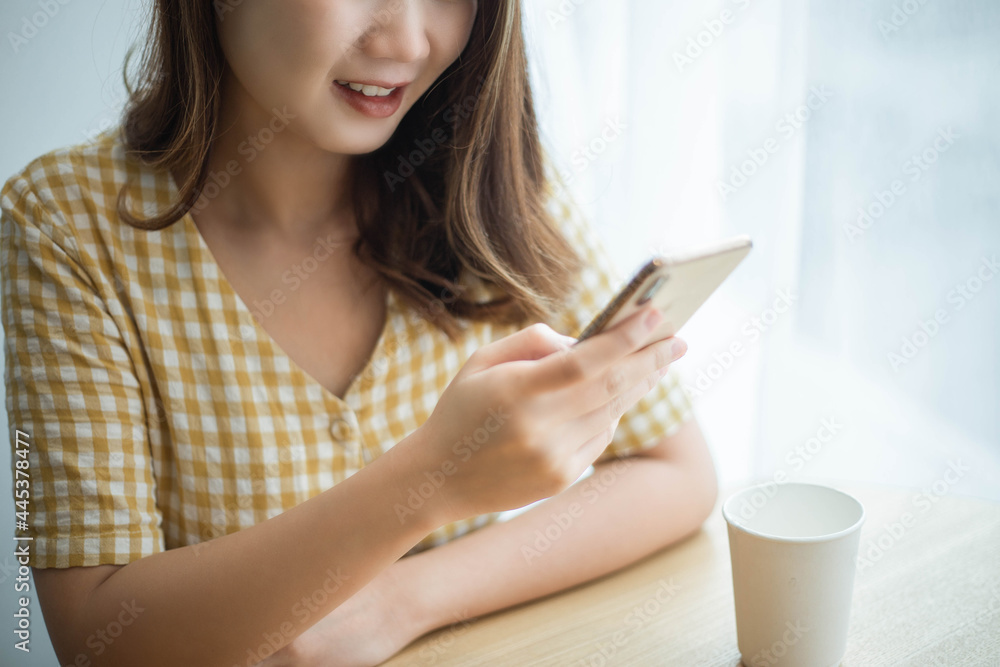 Entrepreneur concept a young female freelancer enjoying break time with social media on the device Entrepreneur concept a young female freelancer enjoying break time with social media on the device