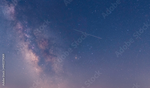 Perseidas, lluvias de estrella cruzando la vía láctea y las nebulosas m8, m11, m6 photo