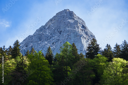 The snow-capped mountains of Val Masino, during spring in the Italian Alps, near the town of San Martino, Italy - May 2021.