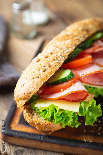 Large sandwich with ham, cheese and vegetables