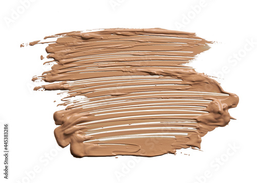 Gently beige strokes and texture of makeup foundation or acrylic paint isolated on white background