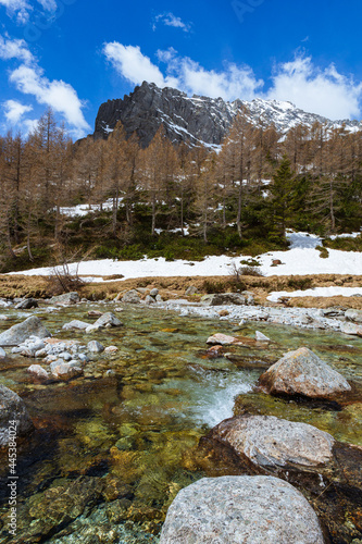 Fototapeta Naklejka Na Ścianę i Meble -  The snow-capped mountains of Val Masino, during spring in the Italian Alps, near the town of San Martino, Italy - May 2021.