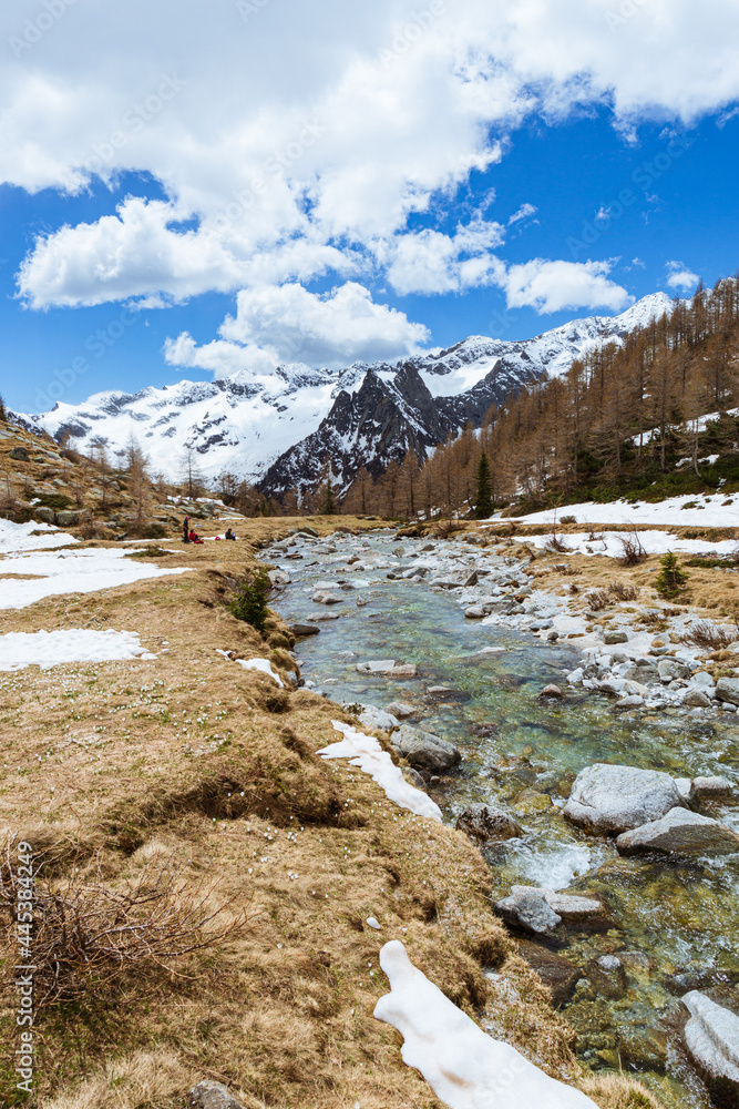 The snow-capped mountains of Val Masino, during spring in the Italian Alps, near the town of San Martino, Italy - May 2021.