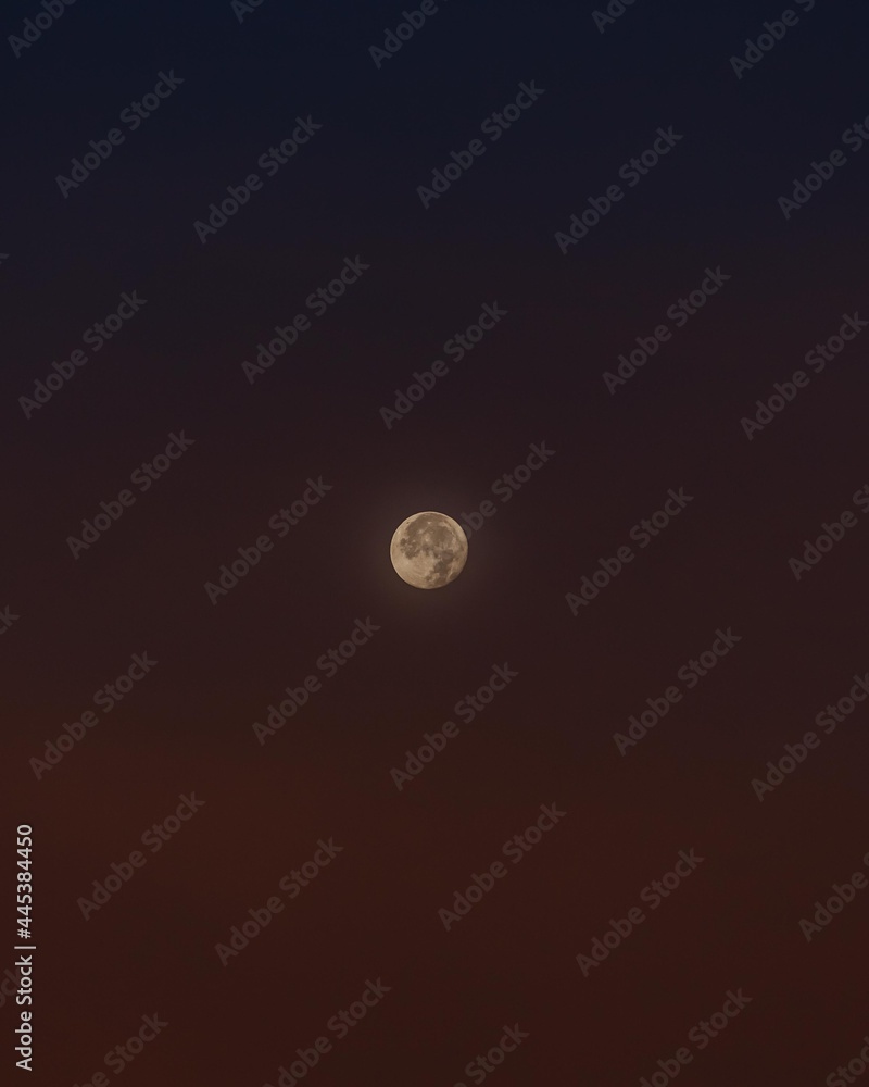 The moon has just risen into the sky in gentle tones. The moon has just risen into the sky in gentle tones.