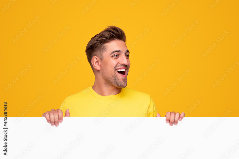 Excited man with blank white banner Excited man with blank white banner