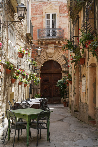 one of the narrow, picturesque street in Tropea, very popular touristic town in Calabria, Italy photo