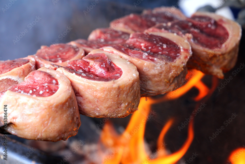 Picanha. Traditional Steak beef in Brazilian barbecue with fire background