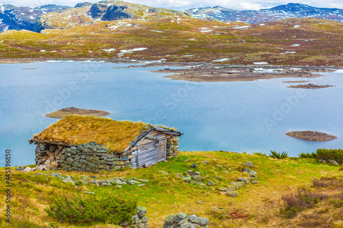 Vavatn lake panorama landscape cottages huts snowy mountains Hemsedal Norway. photo