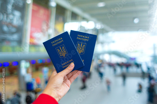 Ukrainian passport in hand at the airport before departure. Travel time