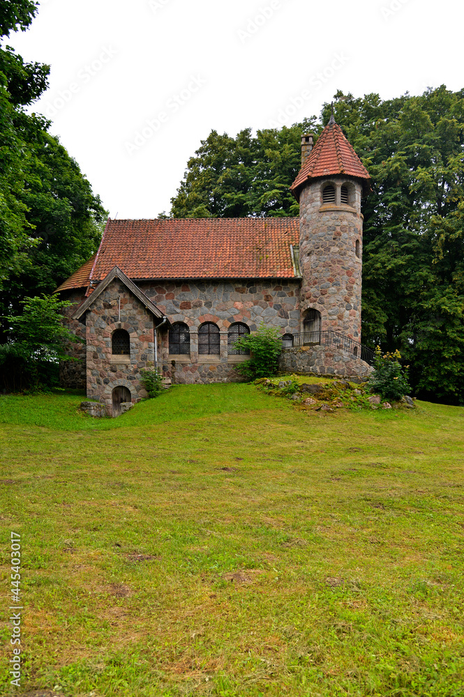 Built in 1925 from field stone, the Neo-Romanesque Evangelical-Ausburg church in Rasząg na warmi in Poland.