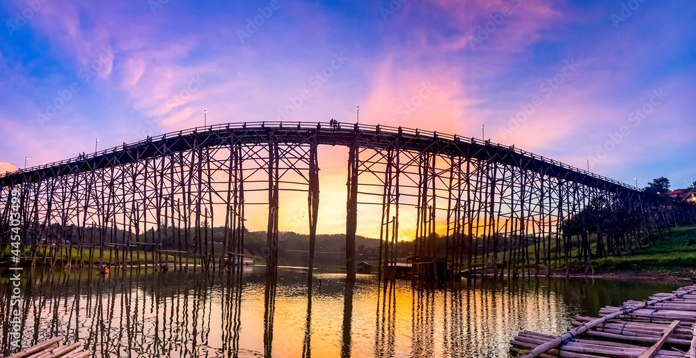 Fototapeta premium Mon Bridge, old wooden bridge at sunset in Sangkhlaburi, Kanchanaburi, Thailand