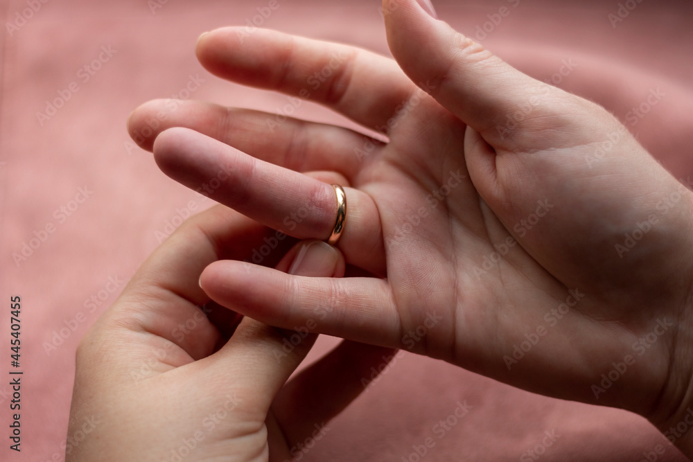 girl can not remove wedding ring close-up