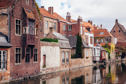 Belgium, West Flanders, Bruges, Old town houses along city canal photo