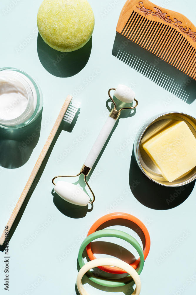© Gemma Ferrando/Westend61 - Studio shot of wooden comb, bamboo toothbrush, colorful bracelets, organic soap, shampoo and other eco-friendly self-care products