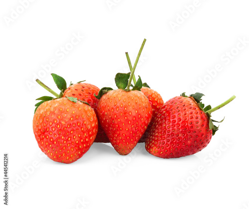 Two red strawberry fruits with green leaves isolated on white background. Clipping path.