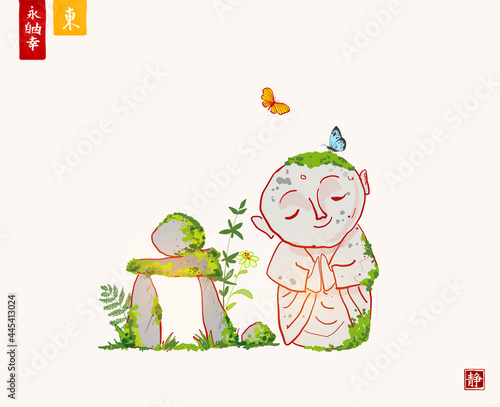 Zen garden composition. Jizo bodhisattva statue and zen rock sculpture. Hieroglyphs - eternity, freedom, happiness, east, silence.
