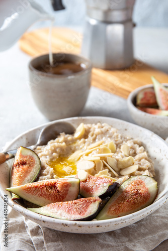 Healthy Oatmeal with figs. Coffee  oatmeal breakfast concept
