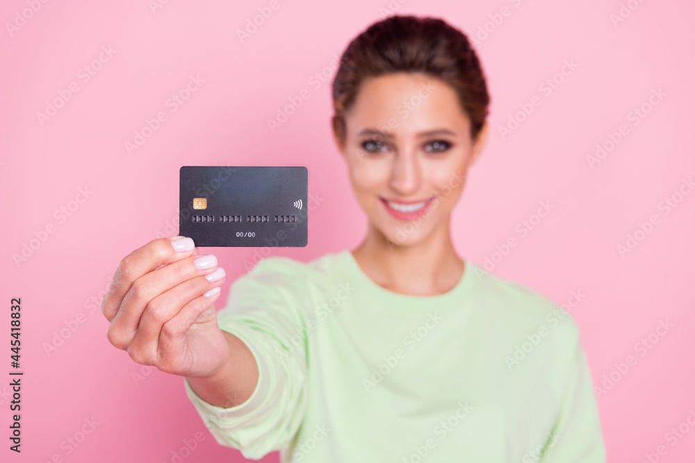 Photo of young girl happy positive smile show bank card buy purchase recommend isolated over pastel color background Photo of young girl happy positive smile show bank card buy purchase recommend isolated over pastel color background