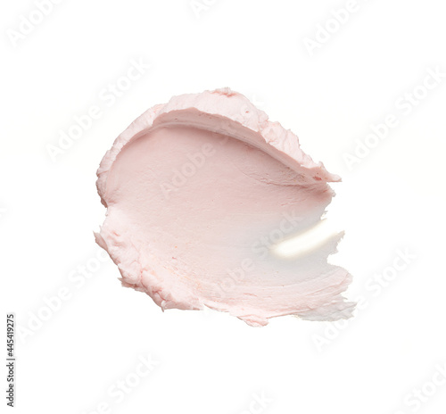 Gently pink smear and texture of face cream or acrylic paint isolated on white background photo