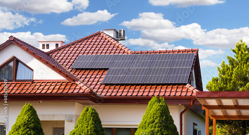 solar panels on roof of house, renewable energy
