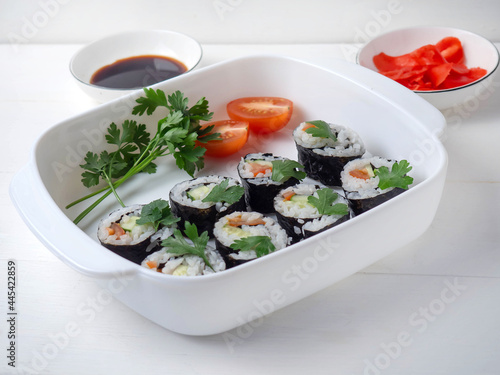 Vegetarian Sushi Maki rolls made of Cucumber, tomato, parsley.