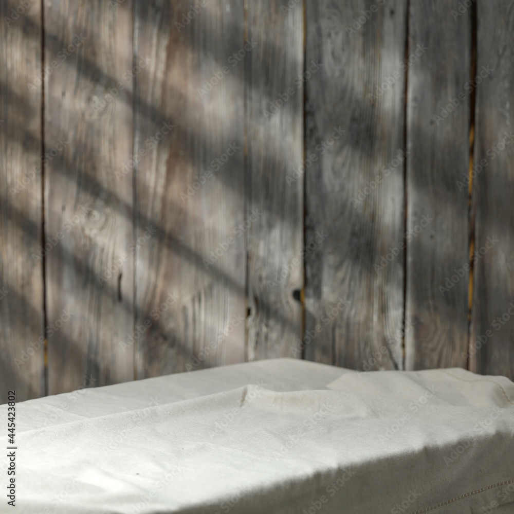 Wooden wall with shadows and table background of free space Wooden wall with shadows and table background of free space