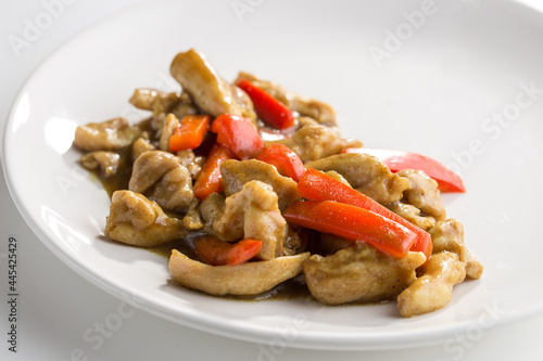 Asian Orange Chicken with bell pepper isolated on white background