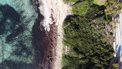 Aerial View by Drone of the Coast in Marina di Pulsano, near Taranto, South of Italy, in a Sunny Day of Waves that Break on the Sand