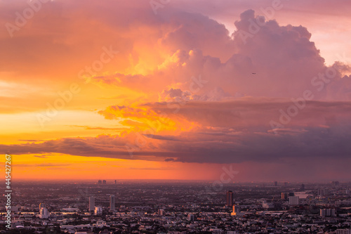 Colorful of sky and cloud in sunset and twilight with cityscape in the evening. Aerial view of bangkok town.