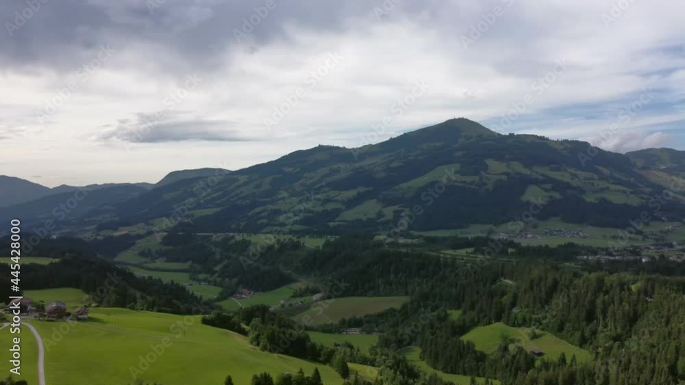 Panning across mountains with dark rainy clouds on one side and beautiful weather on the other side. Panning across mountains with dark rainy clouds on one side and beautiful weather on the other side.