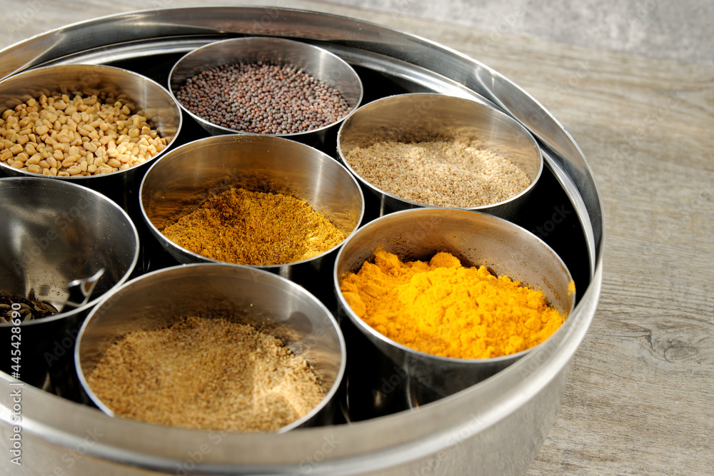 Masala Dabba Indian typical spice box. Spices assortment in round tin. Masala Dabba Indian typical spice box. Spices assortment in round tin.