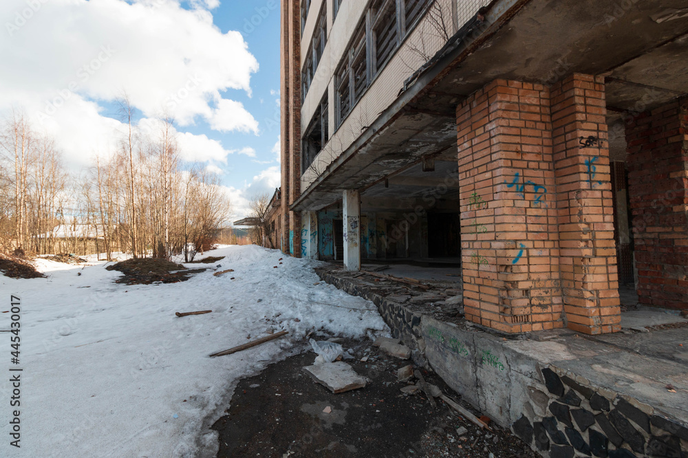 a large abandoned building on the outskirts a large abandoned building on the outskirts